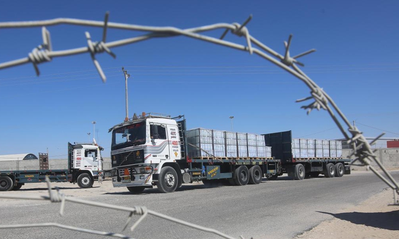 A loaded trailer truck arrives at the Kerem Shalom commercial crossing in the southern Gaza Strip city of Rafah, July 14, 2021. Israel on Monday decided to ease the tight restrictions imposed two months ago on export, import and fishing in the Gaza Strip, Palestinian officials said. The import of medical supplies and raw materials for industry and textiles will be allowed from Israel to Gaza through the commercial crossing of Kerem Shalom.Photo:Xinhua