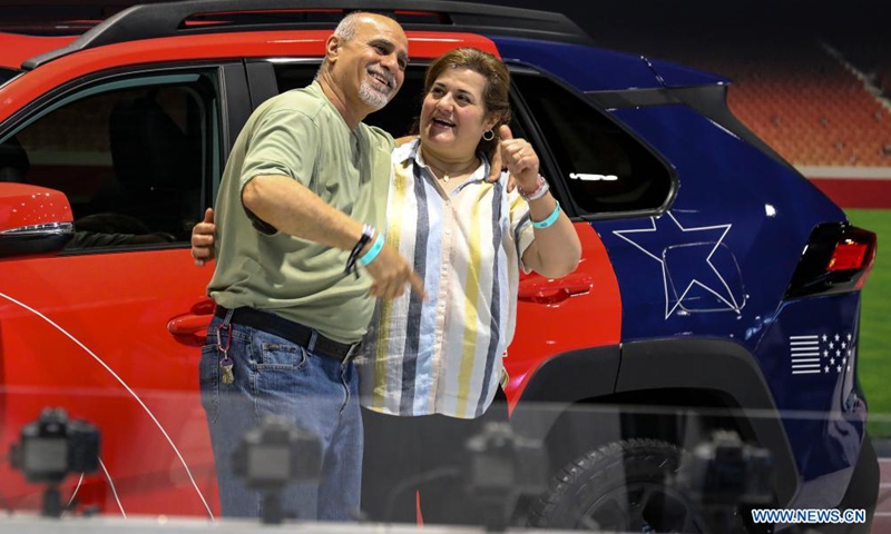 A couple poses in front of a Toyota RAV4 at the 2021 Chicago Auto Show held at McCormick Place in Chicago, the United States, on July 15, 2021. The 2021 Chicago Auto Show kicked off on Thursday with more than 20 manufacturers from all over the world showcasing their latest vehicles.Photo:Xinhua