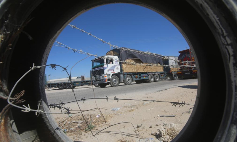 A loaded trailer truck arrives at the Kerem Shalom commercial crossing in the southern Gaza Strip city of Rafah, July 14, 2021.Photo:Xinhua