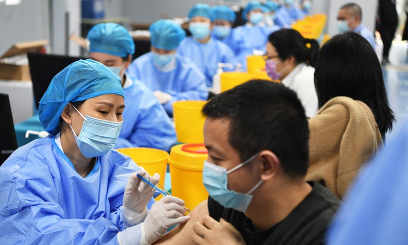 People receive COVID-19 vaccination at a temporary vaccination site in Jiangbei District of Chongqing, southwest China, April 8, 2021.Photo:Xinhua