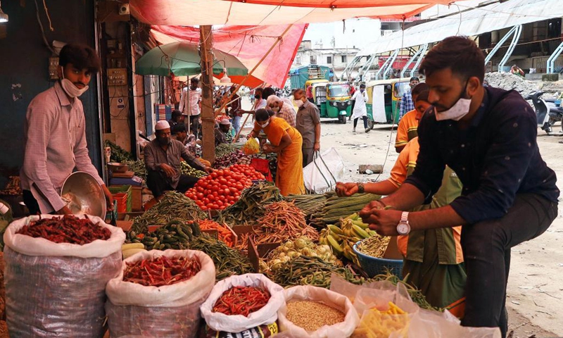 Vendors resume business as the COVID-19 restrictions ease at one of the oldest market in Bangalore, India, July 16, 2021.Photo:Xinhua