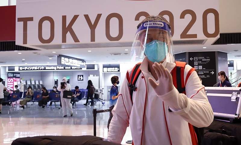 Jia Xiuquan, head coach of the Chinese women's national football team, arrives at the Narita airport in Tokyo, Japan, July 17, 2021. Some members of the Chinese Olympic delegation arrived in Tokyo on Saturday.(Photo: Xinhua)