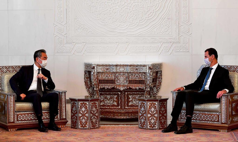 Syrian President Bashar al-Assad (R) meets with visiting Chinese State Councilor and Foreign Minister Wang Yi in Damascus, Syria, on July 17, 2021. China opposes any attempt to seek regime change in Syria and will boost the mutually beneficial cooperation with Syria for the benefit of the two peoples, Wang Yi said on Saturday. Photo:Xinhua