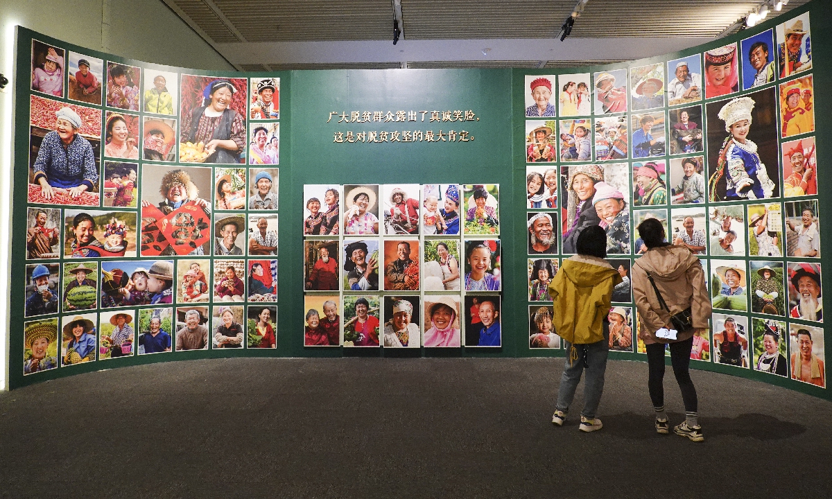 A photo exhibition showcasing China's achievements in poverty alleviation opened at the National Museum of China in June. Photo: VCG