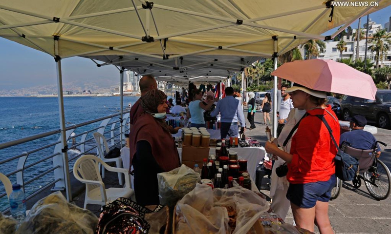 People visit a popular fair of handicrafts and local products at Beirut Corniche in Beirut, Lebanon, on July 18, 2021. (Photo: Xinhua)