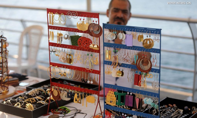 A man sells jewelry at a popular fair of handicrafts and local products at Beirut Corniche in Beirut, Lebanon, on July 18, 2021. (Photo: Xinhua)