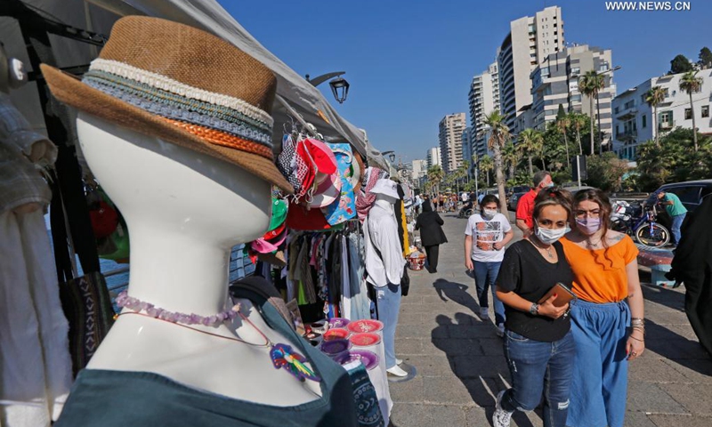 People visit a popular fair of handicrafts and local products at Beirut Corniche in Beirut, Lebanon, on July 18, 2021. (Photo: Xinhua)