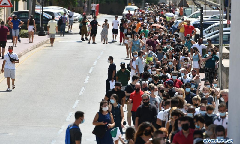 People line up to get COVID-19 vaccination in Mosta, Malta, on July 19, 2021. Malta opened walk-in COVID-19 vaccination clinics for people without appointments on Monday. More mobile vaccination clinics are expected to be opened in the coming days to meet people's demand.(Photo: Xinhua)