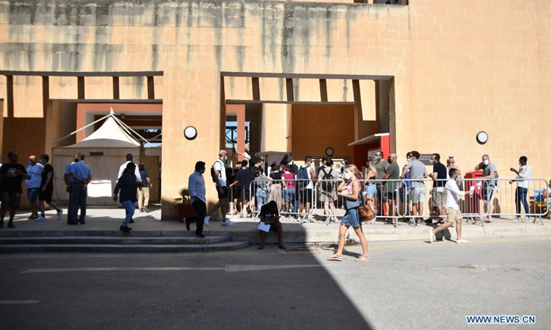 People line up to get COVID-19 vaccination in Mosta, Malta, on July 19, 2021. Malta opened walk-in COVID-19 vaccination clinics for people without appointments on Monday. More mobile vaccination clinics are expected to be opened in the coming days to meet people's demand.(Photo: Xinhua)