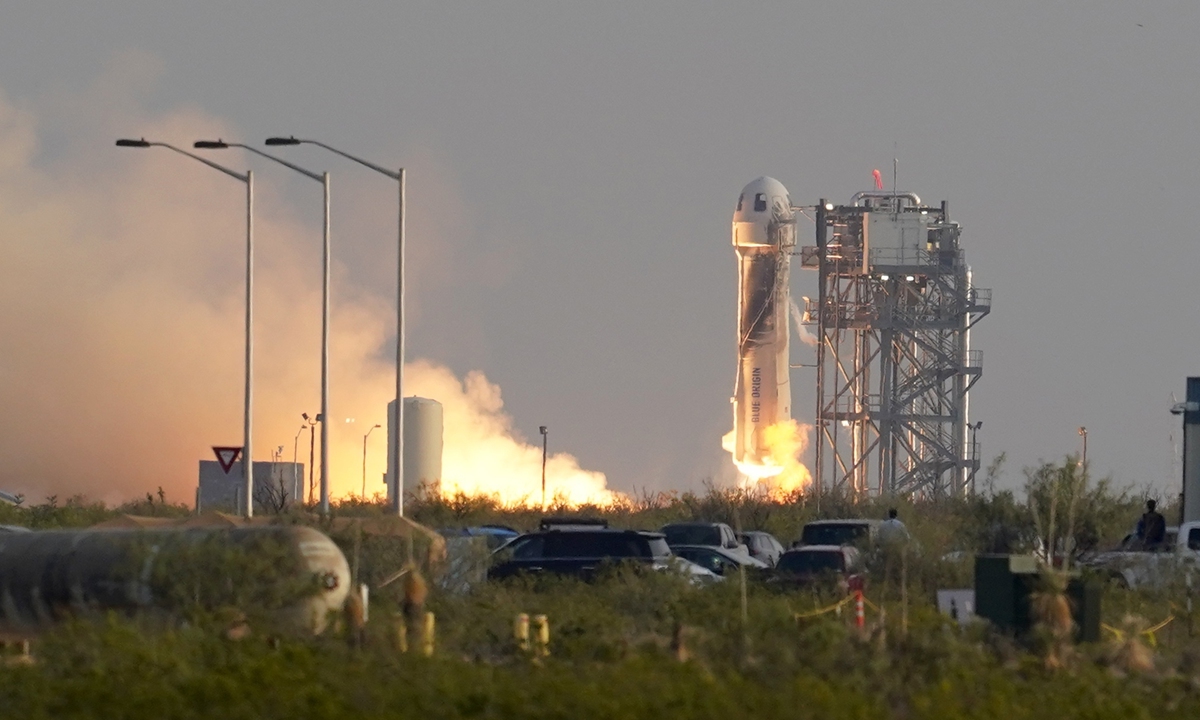 Blue Origin's New Shepard rocket lifts off carrying Jeff Bezos, founder of Amazon and space tourism company Blue Origin, brother Mark, Oliver Daemen and Wally Funk, from its spaceport near Van Horn, Texas, on Tuesday. The capsule returned safely a little more than 10 minutes later. Photo: VCG