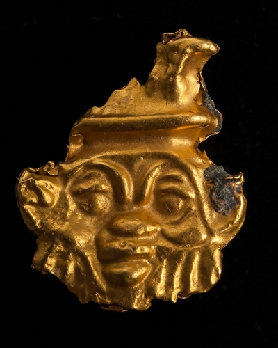 A diver unearths pieces of pottery in the sunken city of Thonis-Heracleion in Abu Qir bay off Egypt's northern Mediterranean coast on Monday.  
Below: A golden fragment uncovered in the sunken city of Thonis-Heracleion Photos: AFP