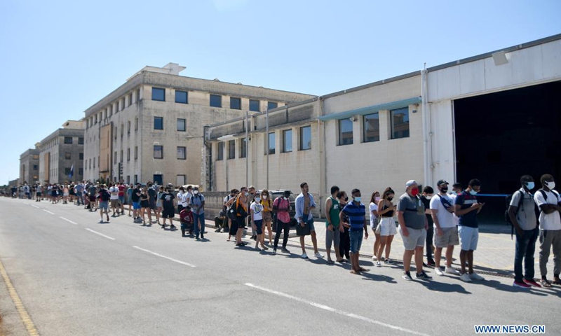People line up to get COVID-19 vaccination in Mosta, Malta, on July 19, 2021. Malta opened walk-in COVID-19 vaccination clinics for people without appointments on Monday. More mobile vaccination clinics are expected to be opened in the coming days to meet people's demand.(Photo: Xinhua)