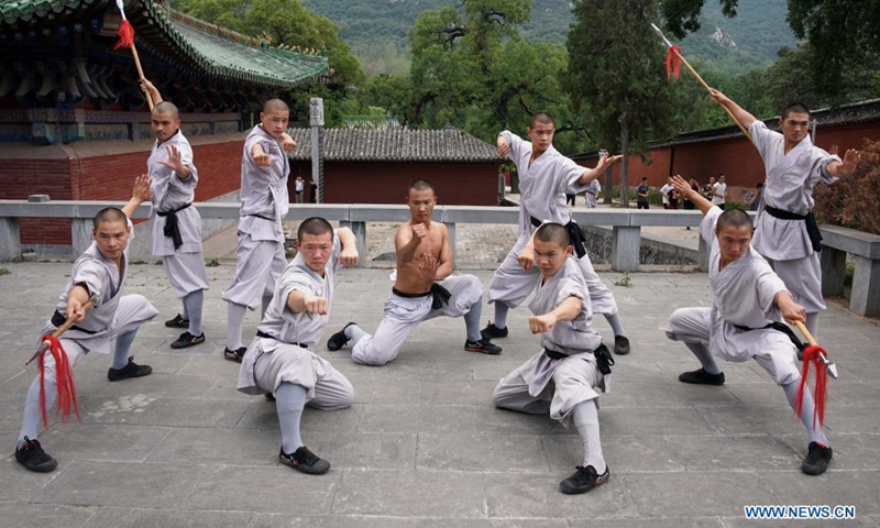 Shaolin monks practice martial arts at Shaolin Temple in Dengfeng City, central China's Henan Province, July 8, 2021. Located on the Songshan Mountain, Shaolin Temple is the birthplace for Shaolin Martial Arts.(Photo: Xinhua)