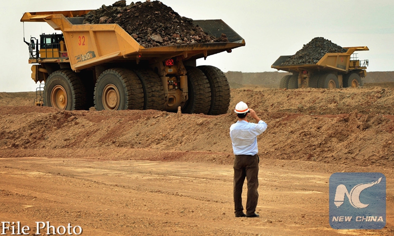 File photo taken on June 23, 2012 shows trucks working the open pit mine at the Rio Tinto operated Oyu Tolgoi gold and copper mine in the Gobi desert, southern Mongolia. (AFP Photo)