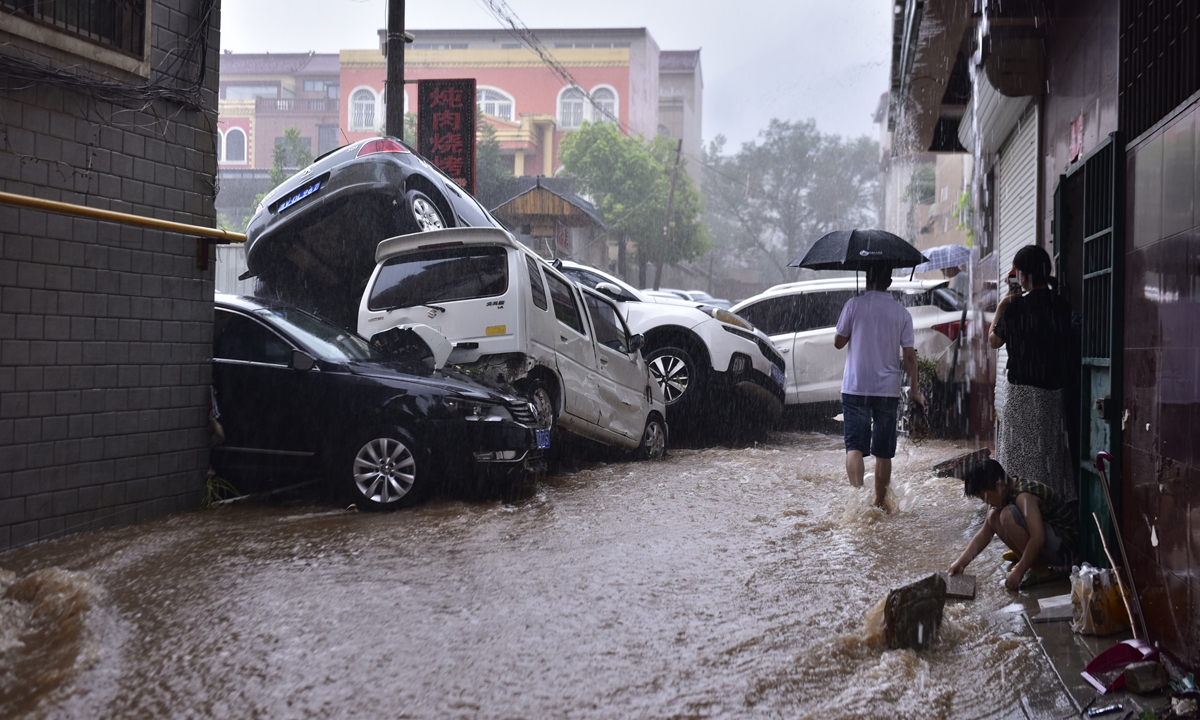 Heavy rainfall hits Zhengzhou, Central China’s Henan Province on Tuesday,  vehicles that are washed away by the floods piled up on top of each other on the flooded roads. Photo: VCG