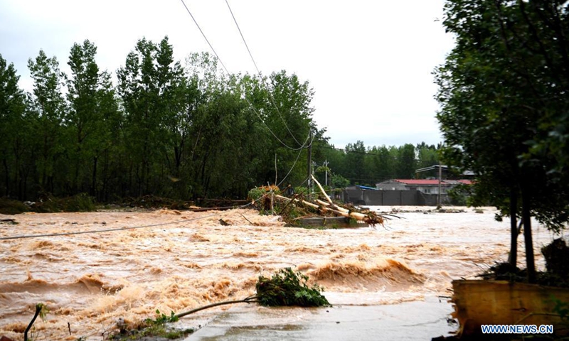 Floods are seen in Longtou Village, Dengfeng City of central China's Henan Province, July 20, 2021. Longtou Village was hit by mountain torrents on Tuesday. Rescuers have transferred over 50 villagers to safer places.(Photo: Xinhua)