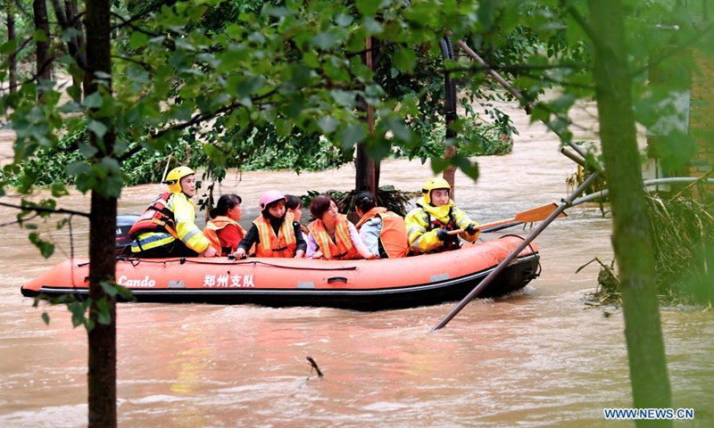 Rescuers transfer stranded villagers in Longtou Village, Dengfeng City of central China's Henan Province, July 20, 2021. Longtou Village was hit by mountain torrents on Tuesday. Rescuers have transferred over 50 villagers to safer places. (Photo: Xinhua)