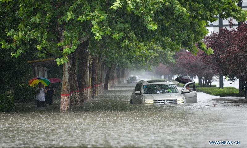 A car is inundated by rainwater in Zhengzhou, capital of central China's Henan Province, July 20, 2021. More than 144,660 residents have been affected by torrential rains in central China's Henan Province since July 16, and 10,152 have been relocated to safe places, the provincial flood control and drought relief headquarters said Tuesday.(Photo: Xinhua)