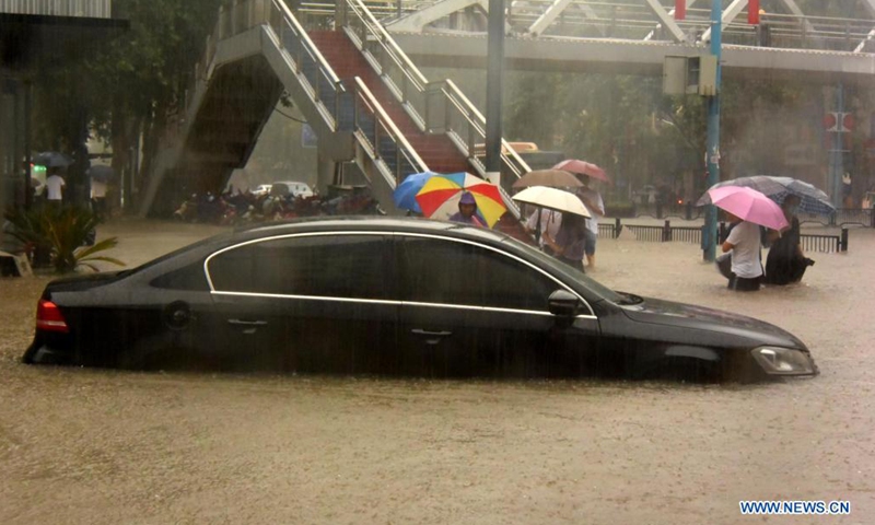A car is inundated by rainwater in Zhengzhou, capital of central China's Henan Province, July 20, 2021. More than 144,660 residents have been affected by torrential rains in central China's Henan Province since July 16, and 10,152 have been relocated to safe places, the provincial flood control and drought relief headquarters said Tuesday.(Photo: Xinhua)