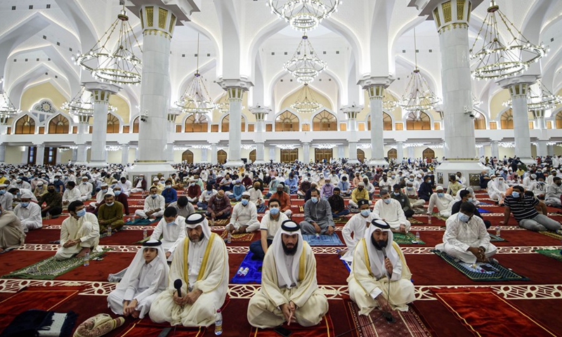 Muslims hold morning prayers to mark Eid al-Adha at the Imam Muhammad bin Abdulwahhab Mosque in Doha, Qatar, on July 20, 2021.(Photo: Xinhua)