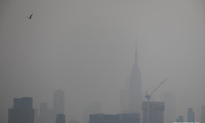 Empire State Building in Manhattan is seen in a thick haze in New York, the United State, July 20, 2021. Smoke from the wildfires in the western U.S. has contributed to the haze, according to local weather service. (Xinhua)