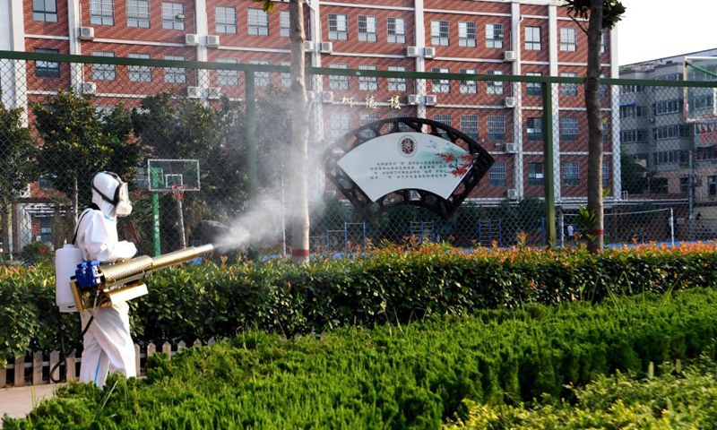 A rescue worker sprays disinfectant at the No. 22 Middle School in Xinxiang, central China's Henan Province, July 25, 2021. Disinfection works are underway in schools, hospitals, garbage transfer stations and some other areas in the flood-hit city of Xinxiang. Photo: Xinhua