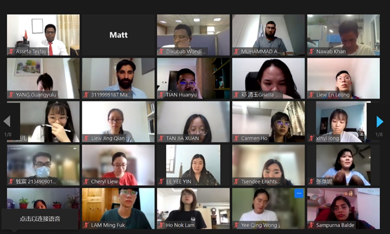 Foreign students attend the camp’s opening ceremony online.