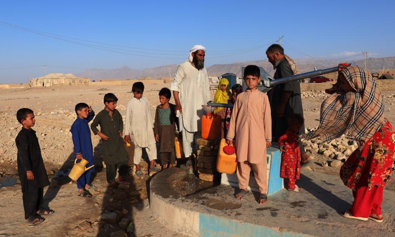 People get water from a hand pump at a displaced person camp in Mazar-i-Sharif, capital of northern Balkh province, Afghanistan, on July 22, 2021.Photo:Xinhua