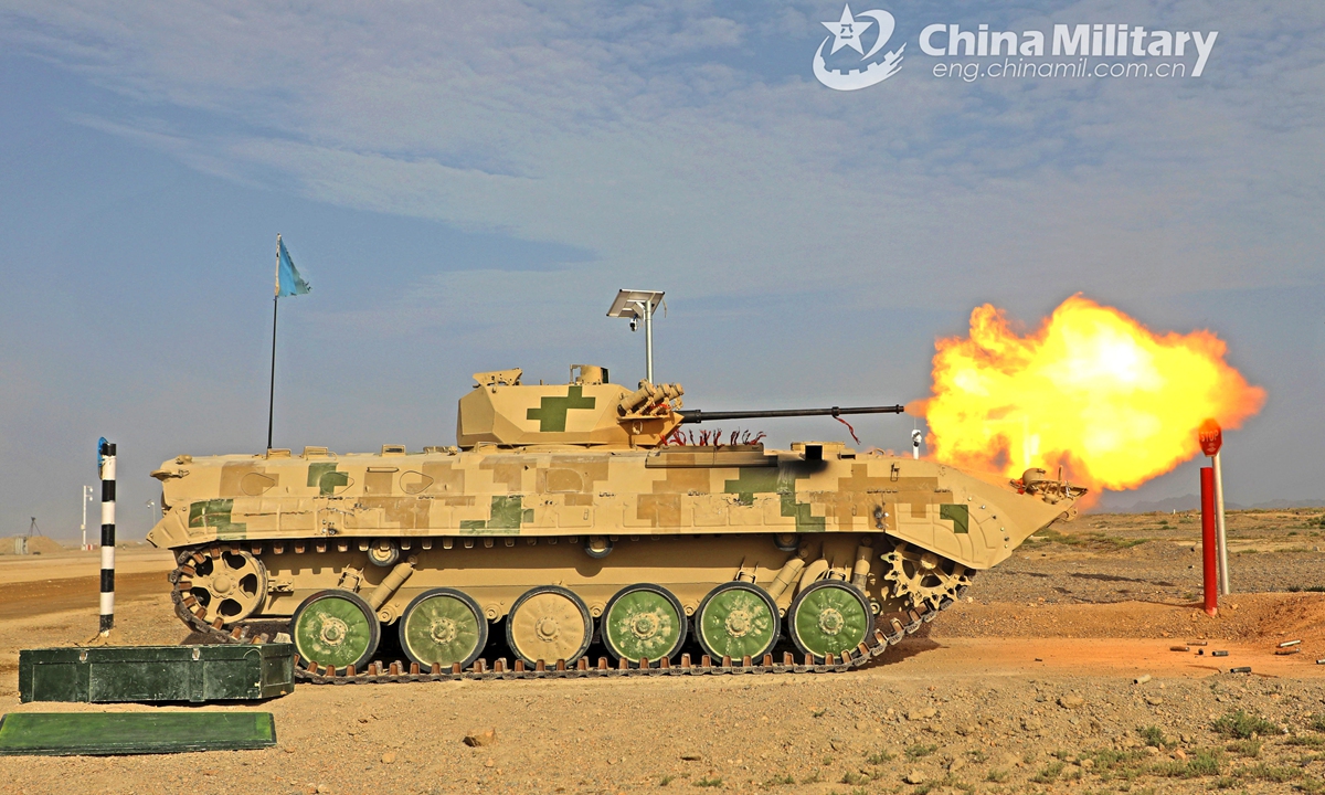 Parking at the firing point, an infantry fighting vehicle (IFV) attached to a combined arms brigade under the PLA Army fires its main gun at a mock ground target during a live-fire training exercise on July 21, 2021.Photo:China Military