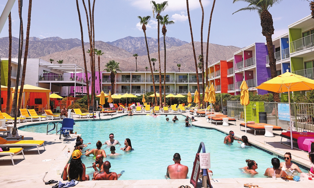 People cool off in a hotel pool in the midday heat on July 11 in California since 