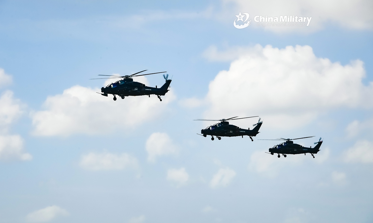 Multi-type attack and transport helicopters attached to an army aviation brigade under the PLA 73rd Group Army fly in formation during a flight training exercise. The training exercise mainly focused on such subjects as ultra-low altitude formation attack, concealment and defense penetration, as well as weapon-using escort. (eng.chinamil.com.cn/Photo by Li Shilong)