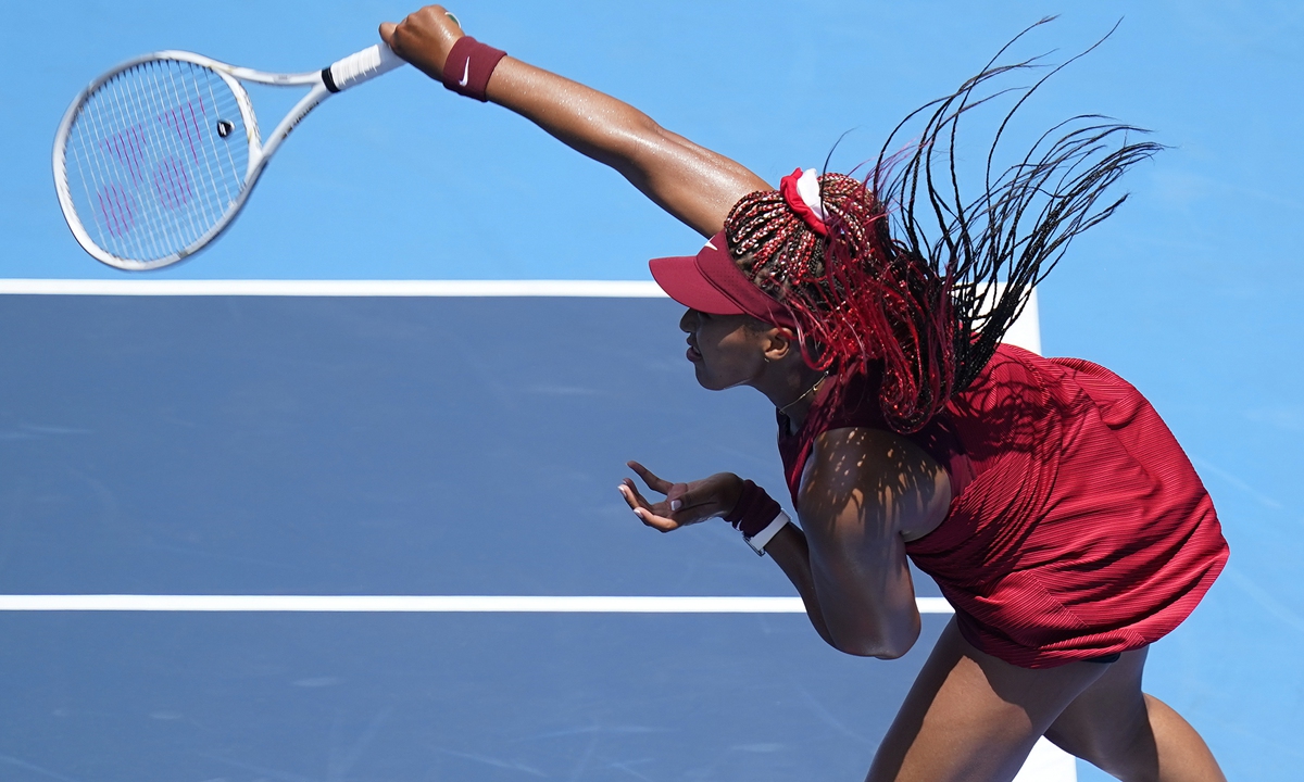 Naomi Osaka of Japan serves to China's Zheng Saisai during the women's tennis competition at the Tokyo Olympics on Sunday in Tokyo, Japan. Photo: VCG