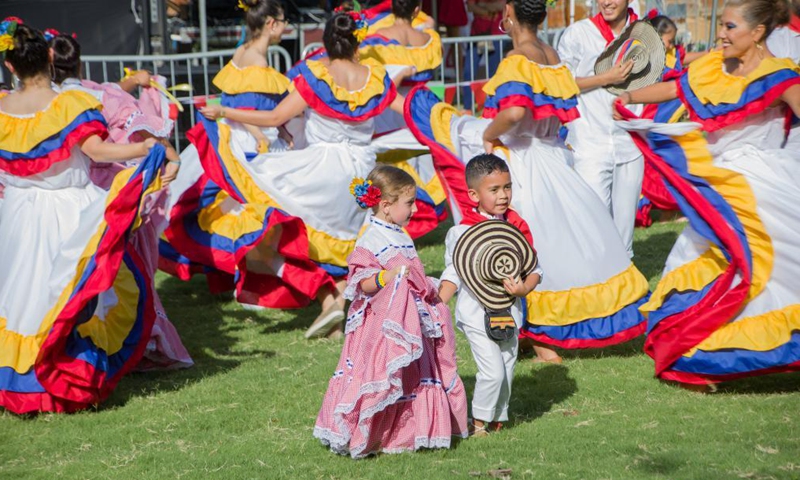 Kids attend the Dallas Colombian Festival in Dallas, the United States, on July 24, 2021. (Photo by Dan Tian/Xinhua)