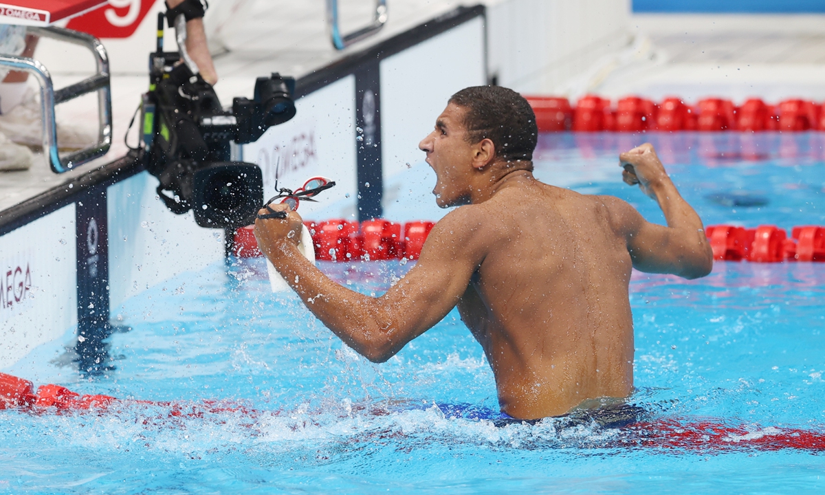 Ahmed Hafnaoui of Tunisia celebrates after winning in the men's 400 meters freestyle final on Sunday. Photo: Cui Meng/GT