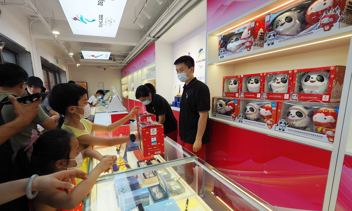 Customers shop at a store offering merchandise for the Beijing 2022 Winter Olympics at Tiananmen Square in Beijing on Monday. The shop opened on Sunday. The opening ceremony of the Beijing 2022 games is scheduled to take place on February 4, 2022. Photo: cnsphoto