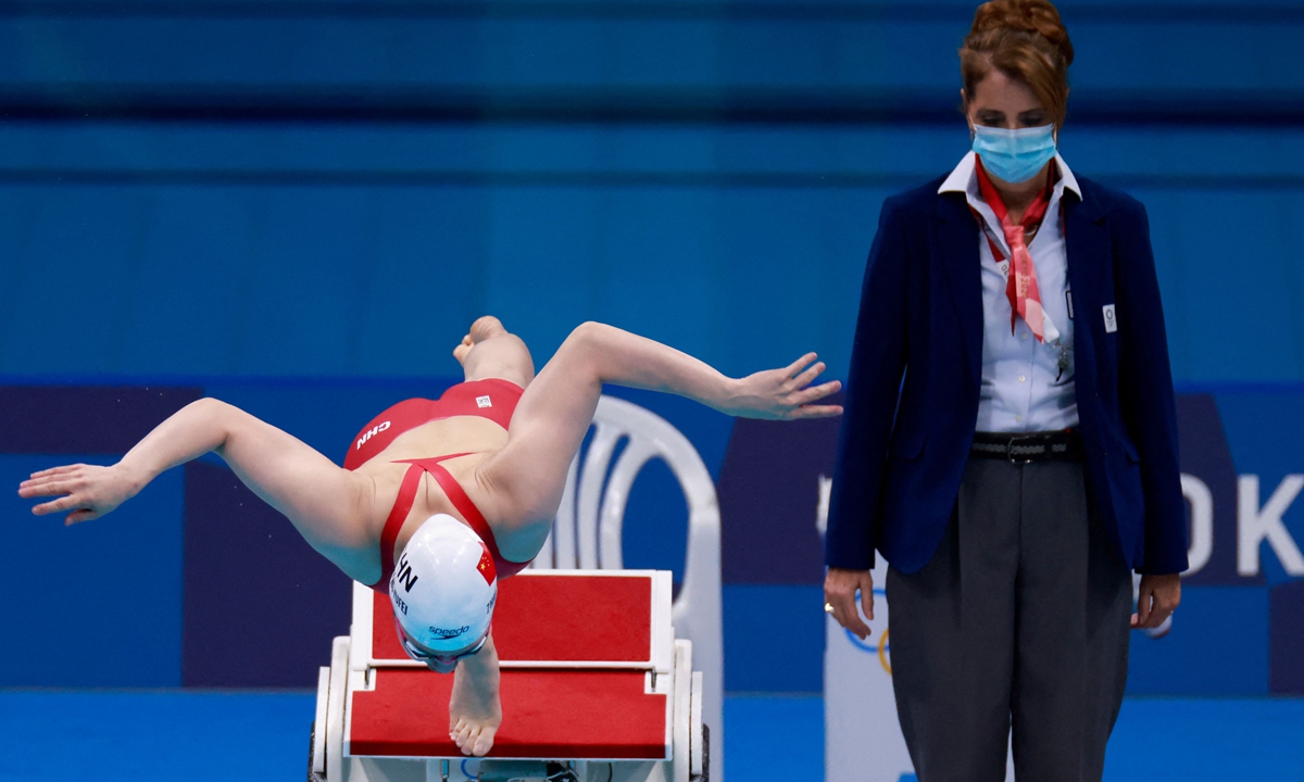 Silver medalist China's Zhang Yufei dives to start in the final of the women's 100-meter butterfly swimming event during the Tokyo 2020 Olympic Games on Monday. Photo: VCG