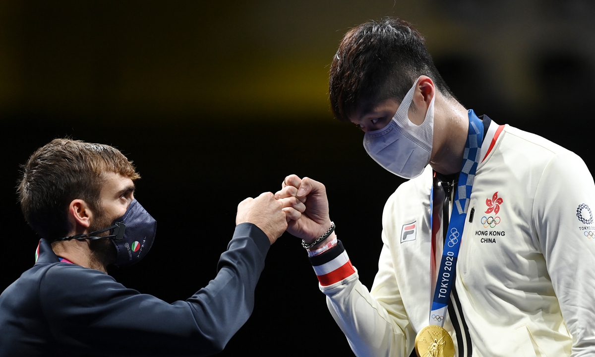 Cheung Ka Long (right) of China's Hong Kong and Daniele Garozzo of Italy react during the ceremony for the men's foil individual gold medal match at the Tokyo 2020 Olympic Games in Tokyo, Japan, on Monday. Photo: Xinhua