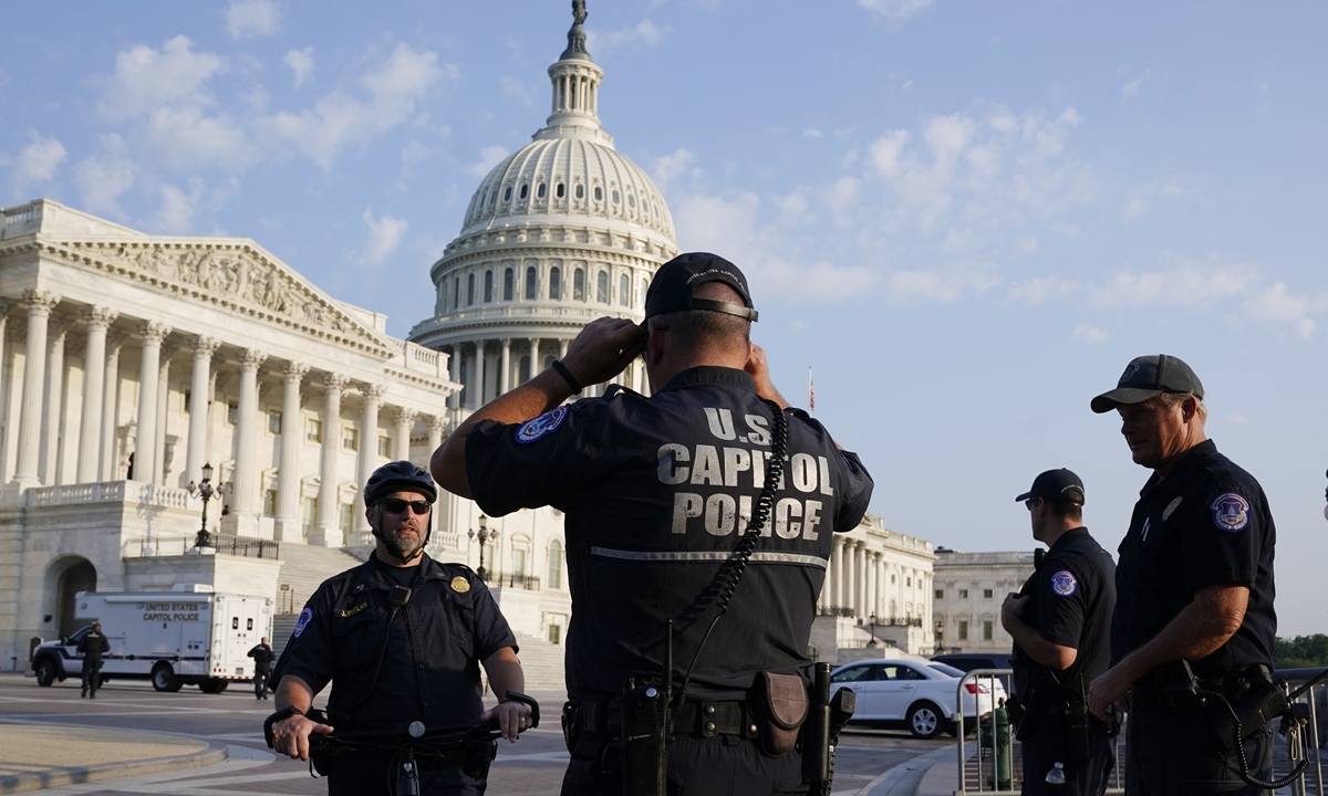 The US Capitol is seen in Washington early Tuesday as US Capitol Police watch the perimeter. Democrats are launching their investigation into the Jan. 6 Capitol riots. The police officers who are testifying Tuesday endured some of the worst of the brutality. Photo: VCG
