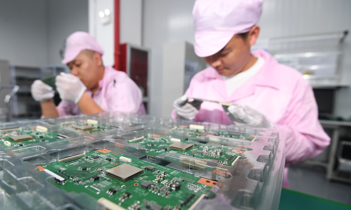 Workers make semiconductors at a company in Guiyang, Southwest China's Guizhou Province on Tuesday. In recent years, China has witnessed the blossoming of its chip industry, thanks to generous government policy support, as well as enthusiastic entrepreneurs and venture investors. Photo: cnsphoto