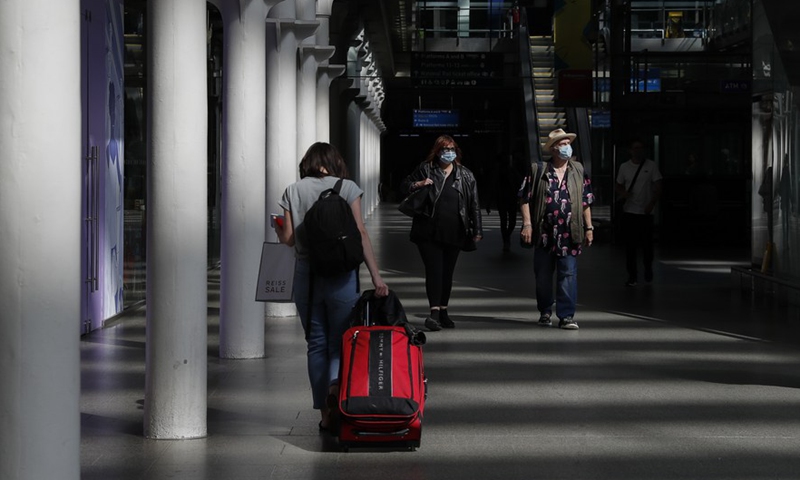 Passengers walk at St. Pancras International Station in London, Britain, July 29, 2021.Photo:Xinhua