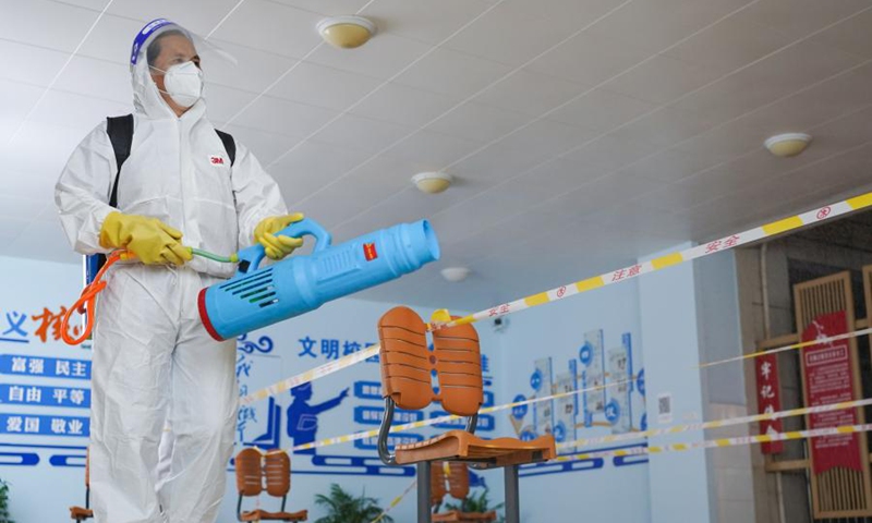 A staff member sprays disinfectant at a COVID-19 testing site in Jiangning District of Nanjing, capital of east China's Jiangsu Province, July 24, 2021.Photo: Xinhua