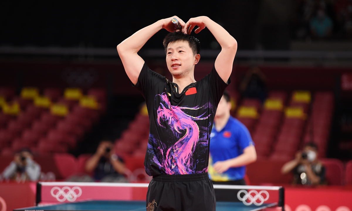 Ma Long celebrates after beating compatriot Fan Zhendong in the men's table tennis singles final at the Tokyo Olympics on Friday. Photo: VCG