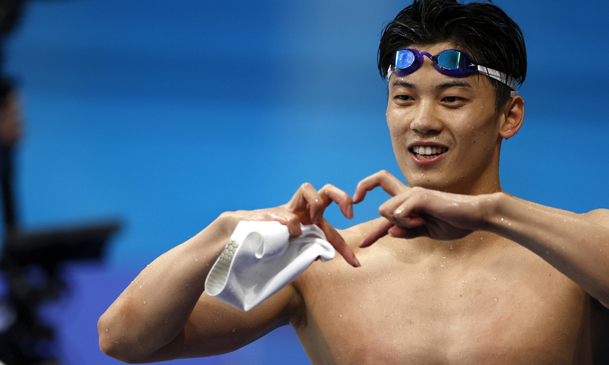 Wang Shun celebrates after winning the men's 200 meters individual medley final on July 30. Photo: IC