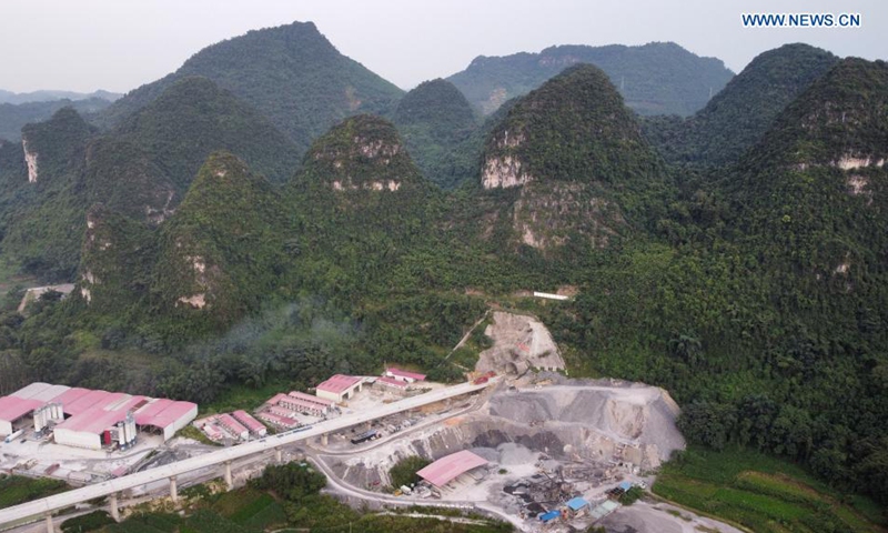 Aerial photo taken on Aug. 2, 2021 shows an external view of the Deqing tunnel of the Guiyang-Nanning high-speed railway in Hechi, south China's Guangxi Zhuang Autonomous Region. The 6.61-km-long Deqing tunnel was drilled through on Tuesday. It is a critical control project in the construction of the Guiyang-Nanning high-speed railway, which is expected to put into operation by the end of 2023. (Xinhua/Liu Lingyi)