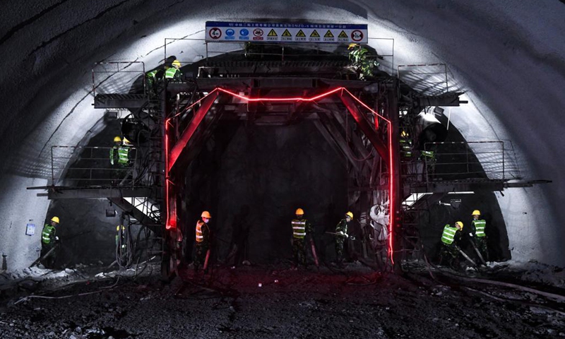 Staff members work inside the Deqing tunnel of the Guiyang-Nanning high-speed railway in Hechi, south China's Guangxi Zhuang Autonomous Region, Aug. 2, 2021. The 6.61-km-long Deqing tunnel was drilled through on Tuesday. It is a critical control project in the construction of the Guiyang-Nanning high-speed railway, which is expected to put into operation by the end of 2023. (Xinhua/Cao Yiming)