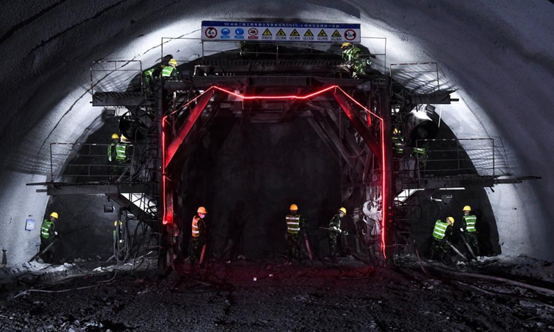 Staff members work inside the Deqing tunnel of the Guiyang-Nanning high-speed railway in Hechi, south China's Guangxi Zhuang Autonomous Region, Aug. 2, 2021. The 6.61-km-long Deqing tunnel was drilled through on Tuesday. It is a critical control project in the construction of the Guiyang-Nanning high-speed railway, which is expected to put into operation by the end of 2023. (Xinhua/Cao Yiming)

