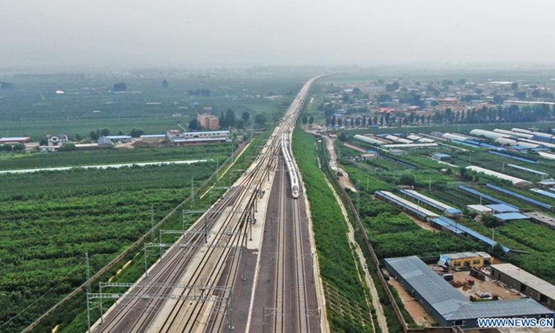 Aerial photo taken on Aug. 3, 2021 shows passenger train No. G9147 from Jinzhou North to Dalian operating along the newly opened Chaoyang-Linghai high-speed railway in northeast China's Liaoning Province. The 107-kilometer Chaoyang-Linghai high-speed railway which connects Chaoyang and Linghai in Liaoning Province was officially put into operation Tuesday.(Photo: Xinhua)