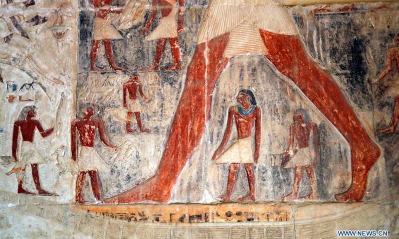 Photo taken on Aug. 3, 2021 shows a colored relief painting inside a high official tomb in Saqqara district, south of Cairo, Egypt. The Saqqara area about 30 kilometers south of Cairo is home to numerous pyramids and a number of beautifully decorated mastaba tombs, in which many colored relief paintings depicting ancient Egyptian daily life are preserved. (Photo: Xinhua)