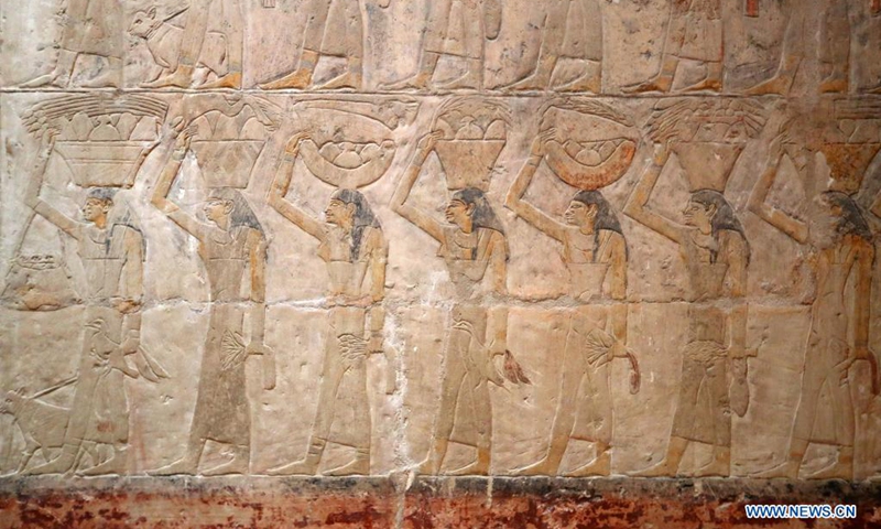 Photo taken on Aug. 3, 2021 shows a colored relief painting inside a high official tomb in Saqqara district, south of Cairo, Egypt. The Saqqara area about 30 kilometers south of Cairo is home to numerous pyramids and a number of beautifully decorated mastaba tombs, in which many colored relief paintings depicting ancient Egyptian daily life are preserved. (Photo: Xinhua)