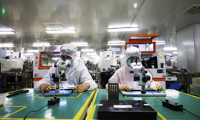 Workers are busy at a chip factory in Suqian, East China’s Jiangsu Province in July 2021. Photo: cnsphoto